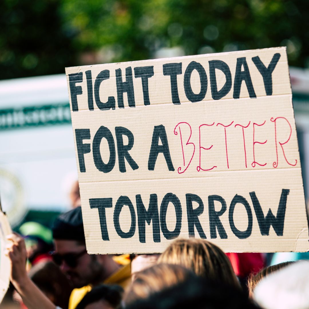 Climate protest placard reading fight today for a better tomorrow